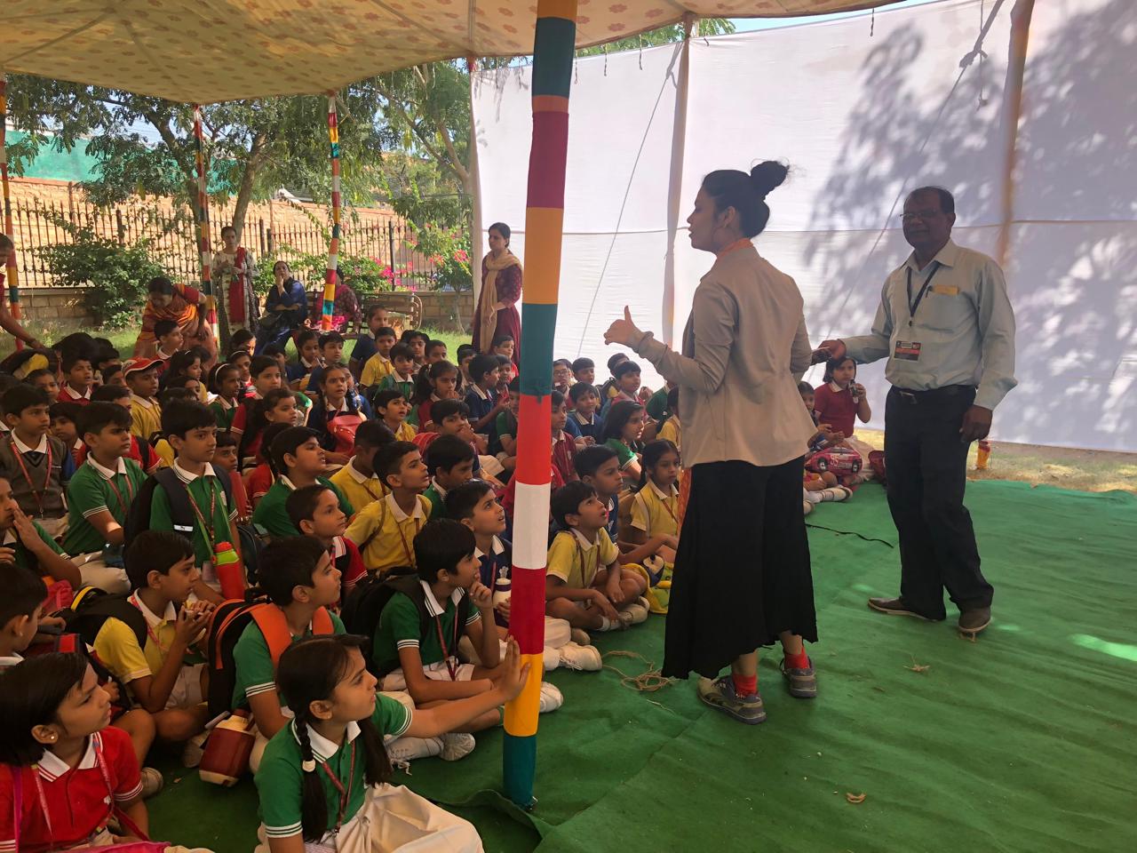 Swati engaging a group of school students in an outdoor workshop